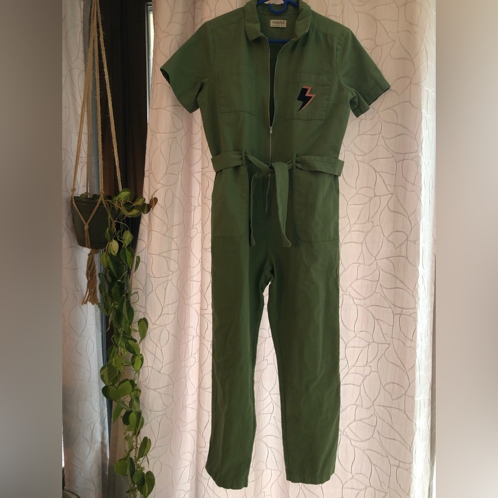 Green jumpsuit with lightning bolt